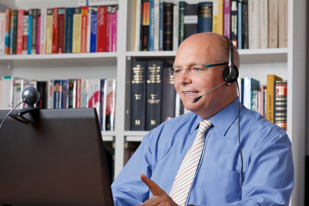 Teaching from home: teacher doing a video conferencing